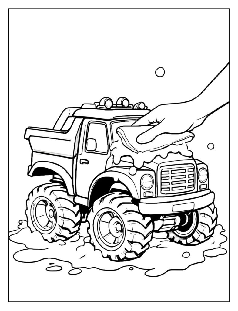 Small RC truck being carefully washed with a sponge and bubbles by a child's hand.
